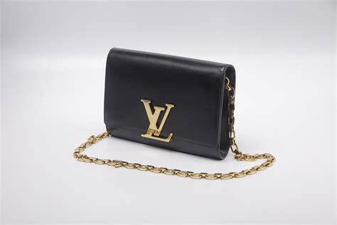 louis vuitton black bag gold chain|louis vuitton book chain wallet.